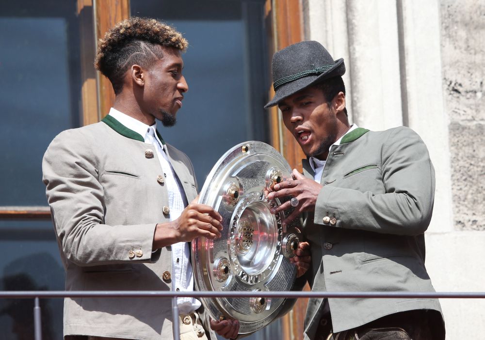 Kingsley Coman and Douglas Costa with the trophy